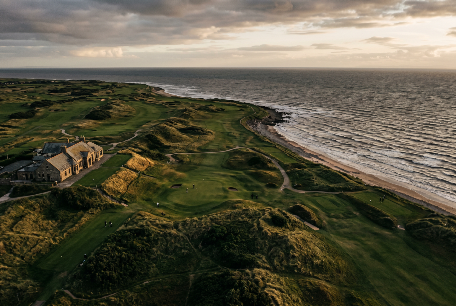 Coastal aerial view of a windswept heritage golf course suggesting patient course management.